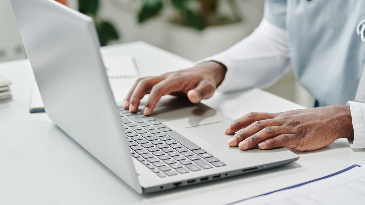 Person typing on a laptop