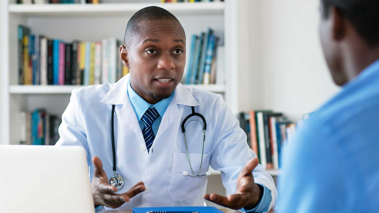 Doctor speaking with patient